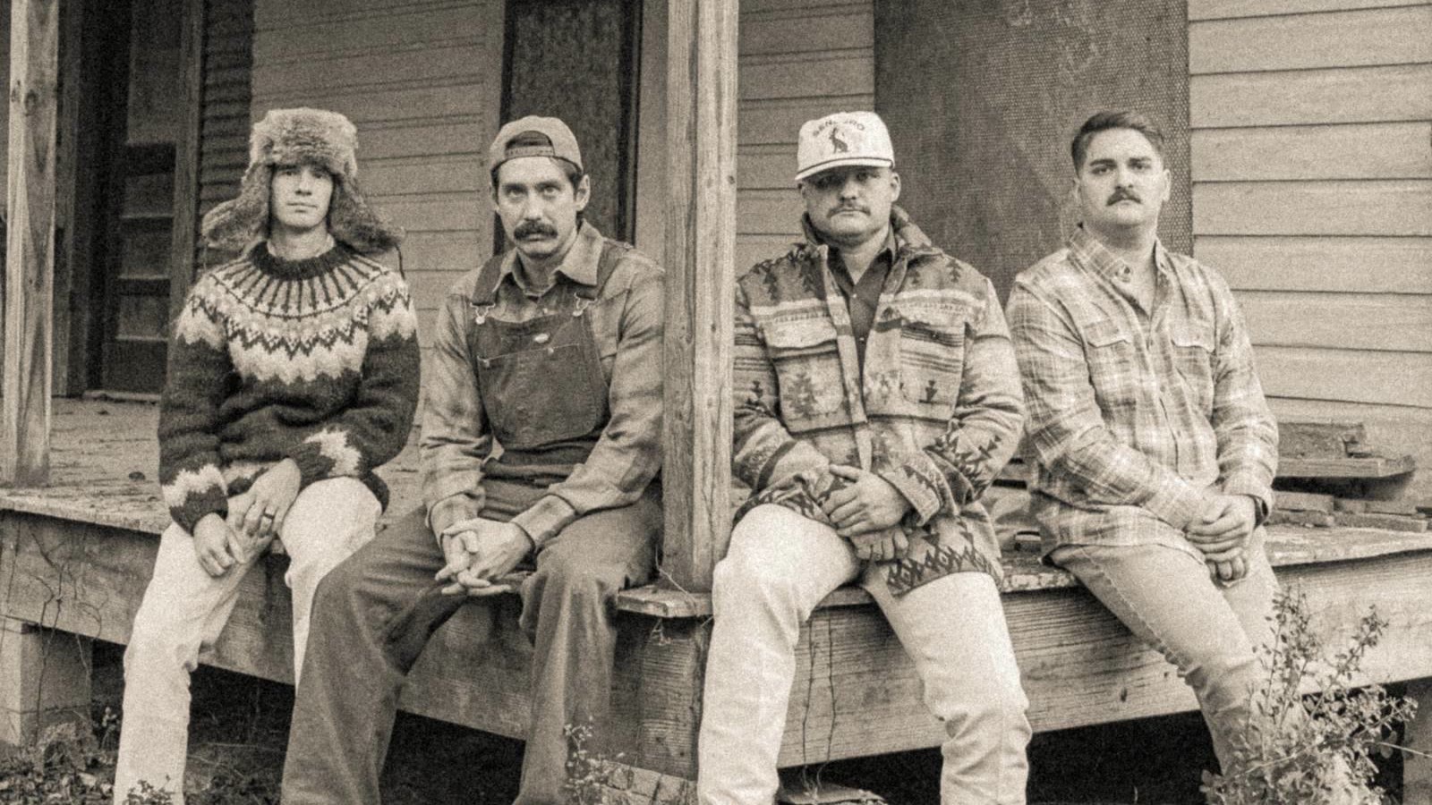 Coyote Pine on the porch of an old farmhouse. Left to right: Matt Peace, Jonathan Chambers, Micah Hughes, Tanner “Rooster” Barnett